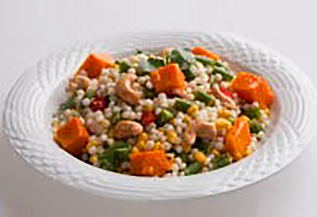 Pearl Couscous salad with vegetables and cashew nuts and a sesame ...